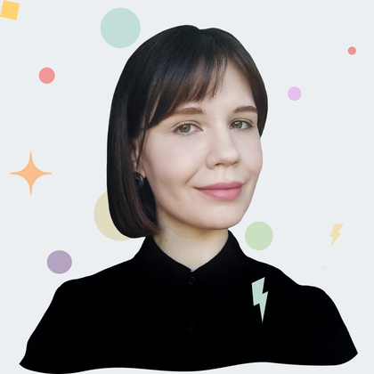 A pale girl with mousy-brown neck-length hair and grey and green eyes. Her head slightly turn to the right. She is wearing a navy blue shirt.